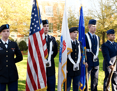 veterans holding american flag